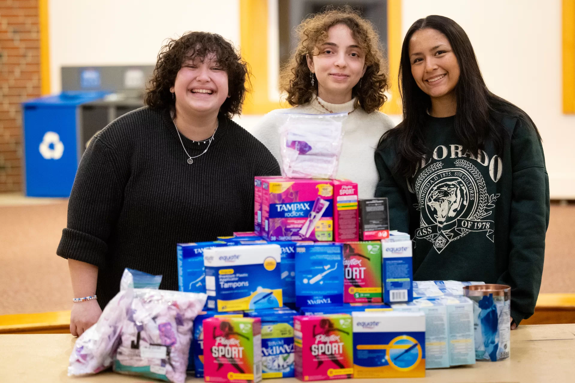 From left, Aleisha Martinez Sandoval ’26 of Mexico City, Jil Moukarzel ’28 of Beirut, and Paloma Rodriguez ’26 of Lima, Peru, helped organize the first annual Bates College Menstrual Product Potluck, a Harward Center-sponsored community initiative dedicated to addressing period poverty by ensuring access to essential menstrual products for individuals in need. (Phyllis Graber Jensen/Bates College)